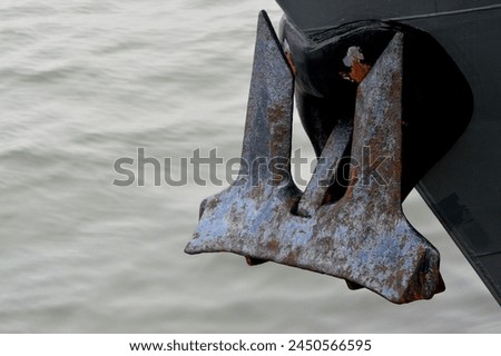 rusting anchor on an iron ship