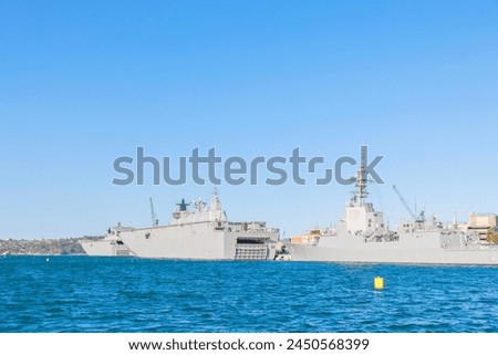 A warship floating in Sydney Harbor, Australia seen from the sea
