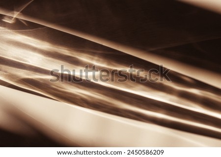 Sunlight background, abstract photo with light and shadow, glare and shiny texture, rainbow flare, beige neutral color monochrome minimal scene. Natural light and caustic effects, trend aesthetic fon.