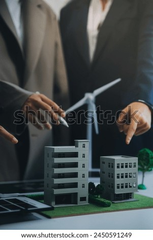 Carbon offset price report CO2 emission. Future growth Net zero waste in ESG ethical SME office protect climate change global warming social issues project. Group of asia people Eco friendly SDGs plan Royalty-Free Stock Photo #2450591249