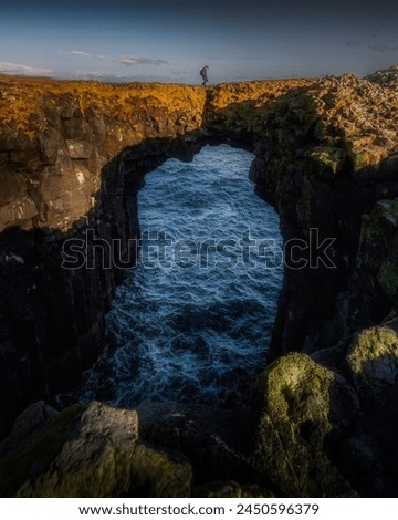 Stone Bridge in Arnarstapi, Iceland. Royalty-Free Stock Photo #2450596379