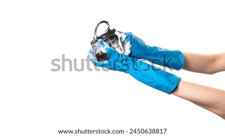 Person Wearing Blue Gloves Holding Camera