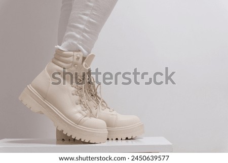 women's beige lace-up shoes with high soles on a white background classic fashion show for buying for winter autumn shoes in a milky store