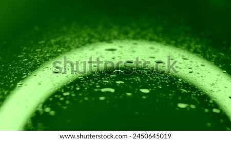 Droplets Pattern On Wet Glass With Intense Green Backlight. Green Screen Droplet Stock Photo