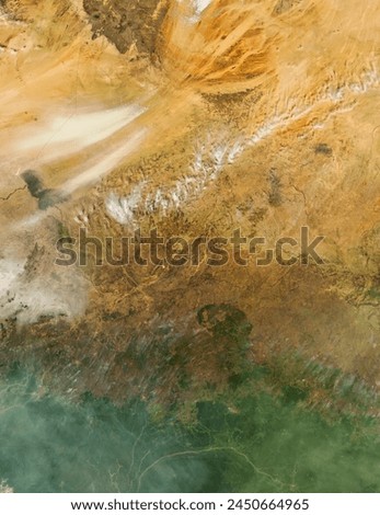 Fires and dust in Central Africa. Fires and dust in Central Africa. Elements of this image furnished by NASA. Royalty-Free Stock Photo #2450664965