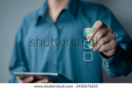 Checklist concept, businessman taking online checklist survey on virtual screen, filling out digital form checklist