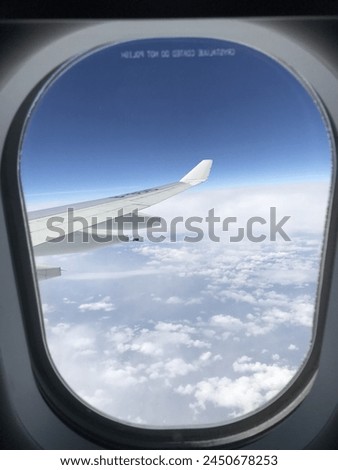 Picture of beautiful blue sky and white cloud from the airplane window