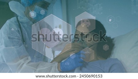 Image of medical icons over diverse doctor and patient wearing face mask. global medicine, healthcare and technology during covid 19 pandemic concept digitally generated image.