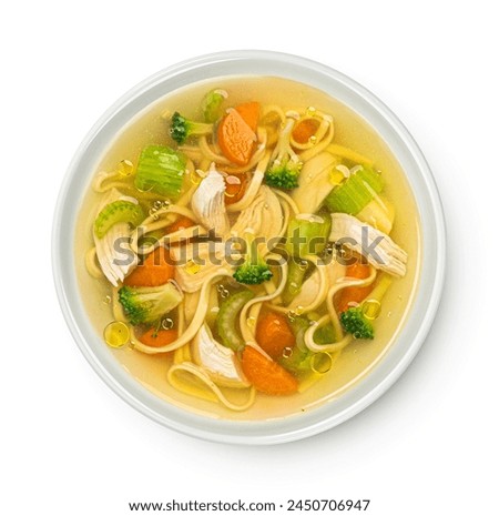 Chicken noodle soup isolated on white background, top view