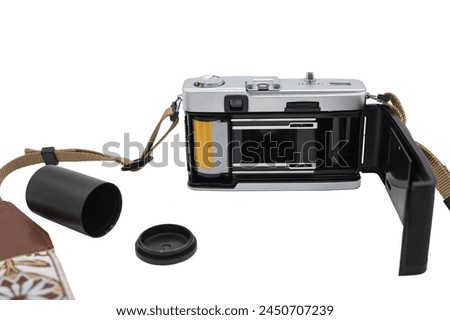 Detail of the loading process of a 35mm film reel in a classic travel photography camera