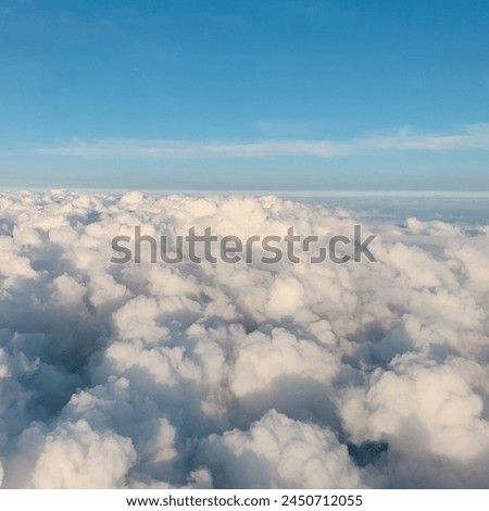 a picture of clouds taken from above in an airplane