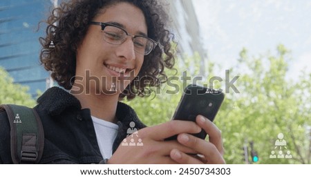 Image of user icons over happy biracial man using smartphone in city. global connections, social media, technology and digital interface concept digitally generated image.