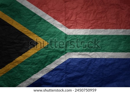 colorful big national flag of south africa on a grunge old paper texture background