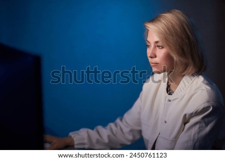 Beautiful Female Video Editor Works with Footage on Her Personal Computer, She Works in Creative Office Studio.