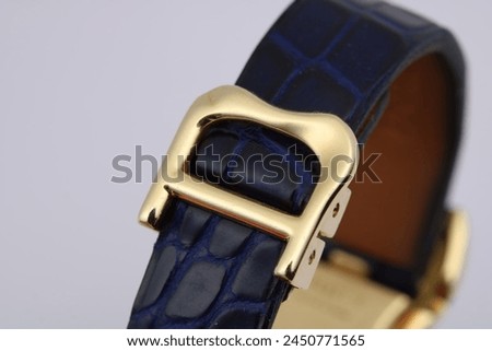 Blue leather strap and gold clasp