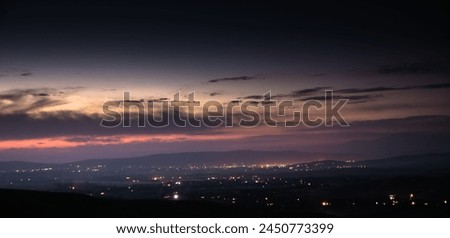 night panorama of the city of Jalal-Abad and stars