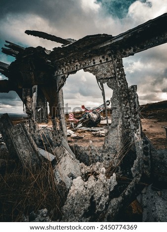 plane crash wreckage on a moorland. Peak Distric National Park.  Royalty-Free Stock Photo #2450774369