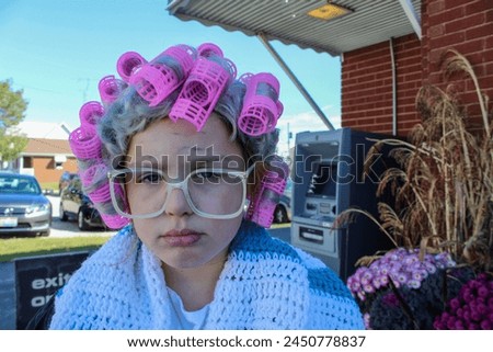 Little girl, child, female, dressed up for Halloween as an old lady, elderly woman. 