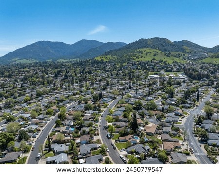 Drone photos of the beautiful landscape of Clayton, California with blue skies, green hills and houses