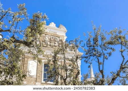 church facade at Square with monument for fallen soldiers in first world war in the centre of Brindisi, Puglia, Italy, on a warm summer day Royalty-Free Stock Photo #2450782383