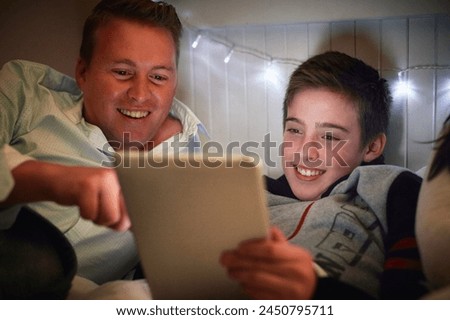 Home, dad and son with tablet at night for online games, reading ebook story and elearning multimedia. Man, father and happy kid streaming cartoon, movies or digital technology in bedroom for bonding