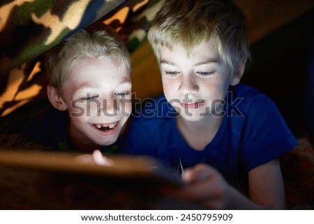 Smile, kids and brothers on tablet in tent at home for game, movie or streaming cartoon online at night together. Happy children, siblings and technology for app, internet or family relax in house