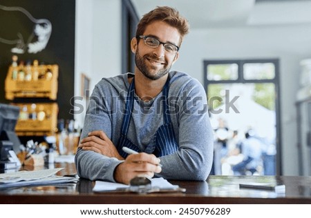 Happy businessman or coffee shop owner with documents or agenda for planning menu and recipes in cafe. Male entrepreneur, paperwork and smile for research, ideas and budget review in restaurant Royalty-Free Stock Photo #2450796289