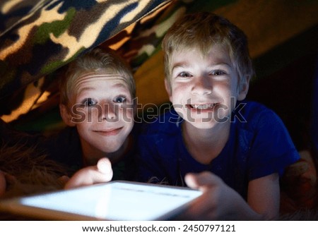 Portrait, happy kids and brothers on tablet in home tent for game, movie and streaming cartoon online at night together. Face, children and smile of siblings on tech, app or family relax in house