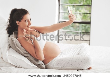 Pregnant, selfie and woman with smile for video call, picture and vlog or live streaming at home on bed to relax. Mother, stomach or influencer for pregnancy by window in bedroom for maternity leave