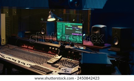 Empty control room filled with buttons and sliders used for recording and editing music, mix and master concept. Professional studio panel board with switchers and pre amp knobs.