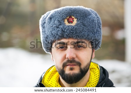 Caucasian man wearing ushanka winter hat with Soviet Union logo