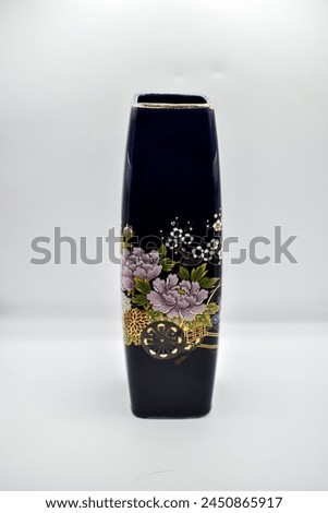 navy  blue square vase with floral pattern