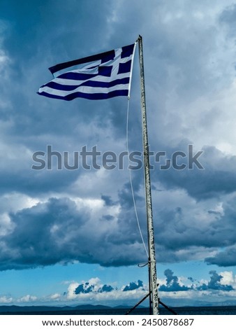 the greek flag flutters in the wind