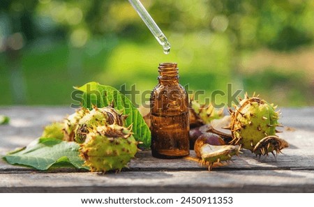 Horse chestnut extract in a bottle. selective focus. nature. Royalty-Free Stock Photo #2450911353