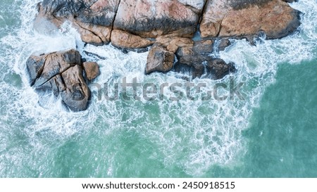 Abstract ocean surf on cliffs. Ocean surf hitting cliffs, abstract composition of white surf and cliffs