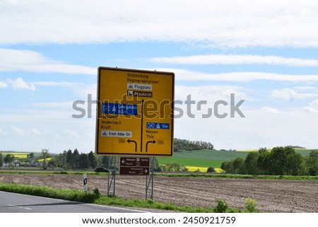 traffic sign to town in the Eifel and the Autobahn