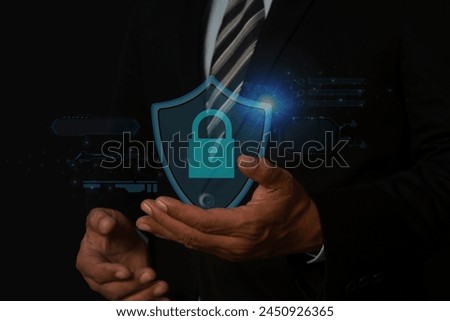 Cybersecurity and privacy concepts to protect data. Business man shows how to protect cyber technology network on computer virtual screen.