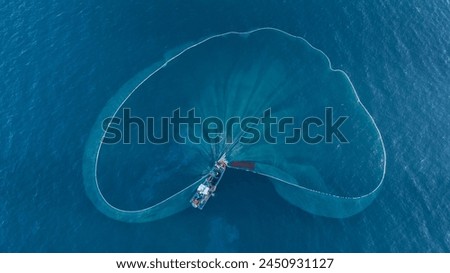 Aerial view to Yacht in deep blue sea. Drone photography. Amasing aerial view to Yacht in deep blue sea with swimming girl. Drone photography