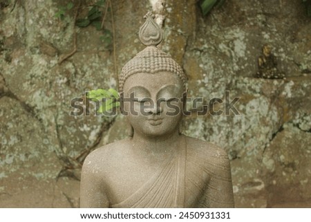 In the heart of silent serenity, he sat,
Beneath the Bodhi tree, where shadows danced,
Buddha, the awakened one, tranquil and wise,
With eyes that beheld the universe's vast expanse. Royalty-Free Stock Photo #2450931331