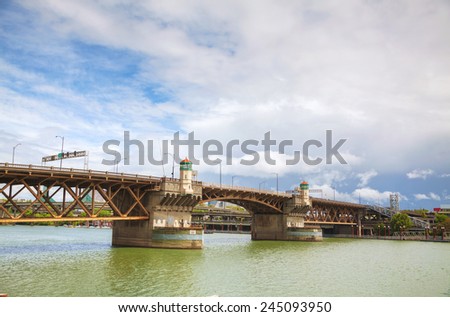 Burnside drawbridge in Portland, Oregon on a cloudy day Royalty-Free Stock Photo #245093950