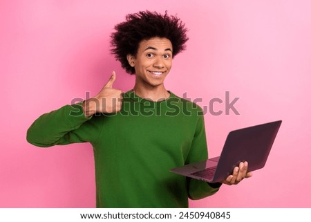 Photo of happy positive freelancer guy use netbook make thumb up symbol isolated pastel color background