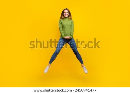 Full body portrait of satisfied glad lady enjoy free time jump toothy smile isolated on yellow color background Royalty-Free Stock Photo #2450941477