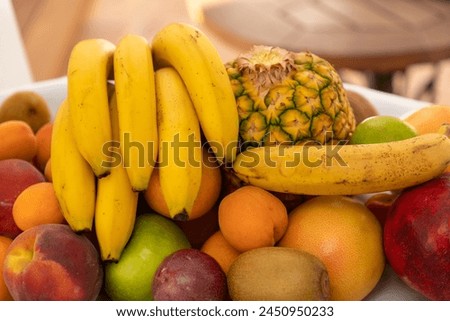Assortiment of fruits with banana, pineapple, kiwi Royalty-Free Stock Photo #2450950233