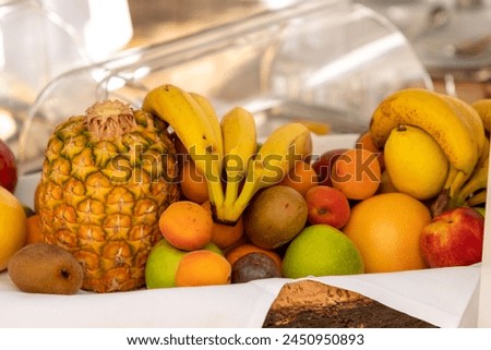 Assortiment of fruits with banana, pineapple, kiwi Royalty-Free Stock Photo #2450950893