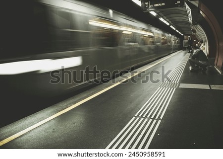 High speed train in motion inside modern train station in Vienna