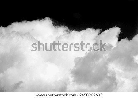White cloud on a black background. Contrasting colors create a bold and vibrant visual effect. Symbolizes simplicity, purity and clarity. Stands out and attracts attention in any design Royalty-Free Stock Photo #2450962635