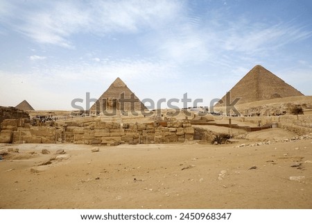 The Giza Pyramid Complex and Sphinx in Giza, Egypt, also called the Giza Necropolis. It was built during the Fourth Dynasty of the Old Kingdom Royalty-Free Stock Photo #2450968347