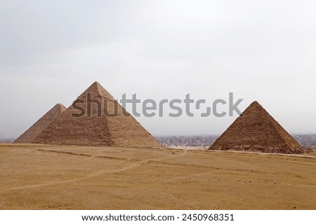 The Giza Pyramid Complex in Giza, Egypt, also called the Giza Necropolis. It was built during the Fourth Dynasty of the Old Kingdom Royalty-Free Stock Photo #2450968351
