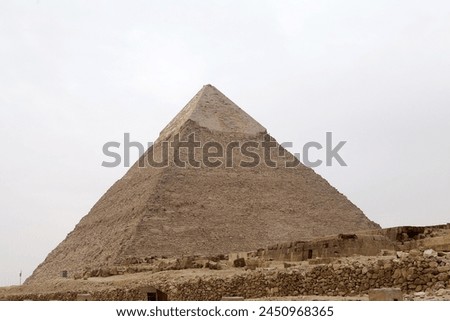 The Pyramid of Khefre at the Giza Pyramid Complex in Giza, Egypt, also called the Giza Necropolis. It was built during the Fourth Dynasty of the Old Kingdom Royalty-Free Stock Photo #2450968365