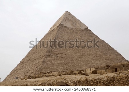 The Pyramid of Khefre at the Giza Pyramid Complex in Giza, Egypt, also called the Giza Necropolis. It was built during the Fourth Dynasty of the Old Kingdom Royalty-Free Stock Photo #2450968371